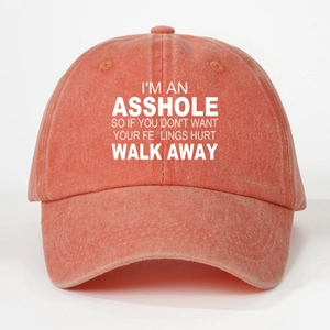 Detail of coral red washed cotton baseball cap with white printed humor slogan text