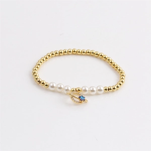 Minimalist copper bracelet with gold beads, white pearls and zircon star pendant
