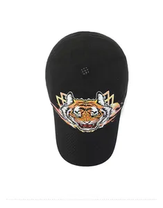 Top view of black tiger head mesh cap showing breathable fabric and polka dot button