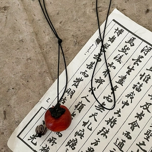 Ethnic style necklace with red persimmon wooden pendant and wax rope for women