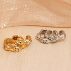 Irregular stainless steel ear cuffs with zircons in gold and silver finish on silk