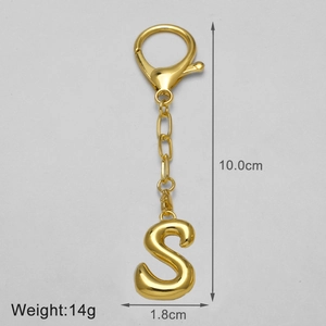Detail view of 18k gold plated letter S keychain with size and weight measurements
