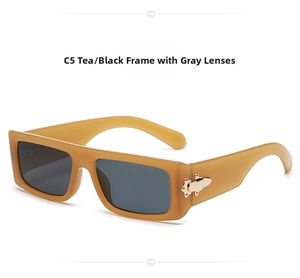 Detail of vintage rectangle tea frames with black lenses and gold side accents