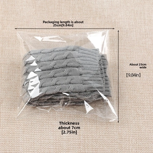 Gray cable knit leg warmers in a clear shipping bag with measurement dimensions