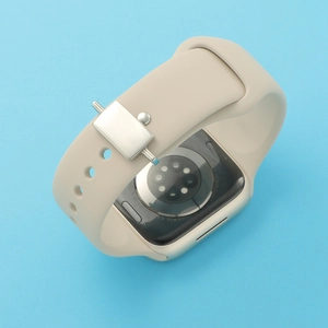 Detailed view of beige silicone smartwatch strap with silver buckle for 40mm models