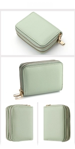 Detail view of light green lychee textured card wallet with double gold zippers