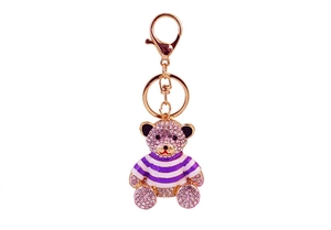 Detail of pink rhinestone-encrusted striped bear keychain with gold metal clasp