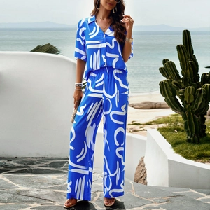 Women's 2-piece summer set featuring blue abstract print V-neck top and wide-leg trousers