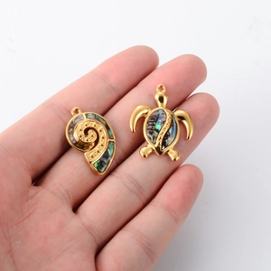 Golden stainless steel turtle and seashell charms with colorful abalone shell inlay