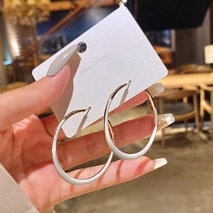 Statement geometric large hoop earrings in gold and white enamel minimalist design