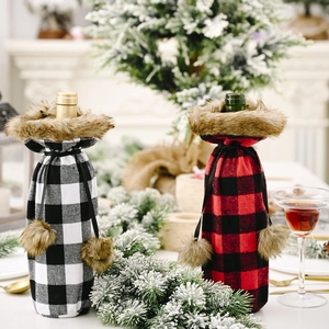 Detail of buffalo plaid wine bottle covers with faux fur collars on a festive table