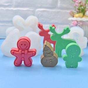 Silicone Christmas molds for baking featuring gingerbread man, snowman and reindeer shapes