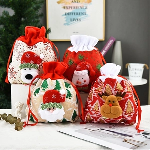 Detail of Christmas drawstring gift bags featuring 3D Santa, Reindeer, and Snowman patches