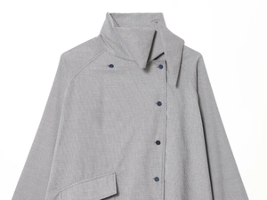 Detail of high neck collar and dark buttons on gray plaid oversized shirt for women