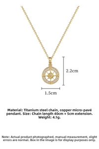 Detail of gold starburst compass pendant with white zircons and dimensions on titanium chain