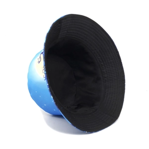 Reversible bucket hat with blue moon star patterns and solid black inner side for sun shade