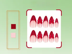 Close-up of almond-shaped press-on nails with 3D red bows and French manicure design