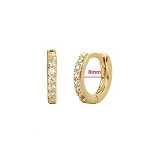 Detailed view of 8mm golden huggie hoop earrings with sparkling cubic zirconia stones
