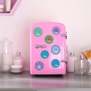 DIY mandala diamond painting stickers for children, applied to a pink mini fridge door