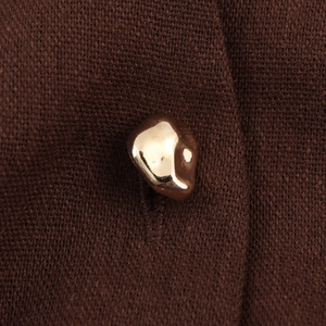 Deep brown knitted utility dress with elegant gold metallic button detail and waist belt
