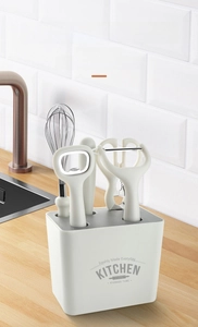 Modern 6-piece kitchen gadget set including whisk and peeler in a minimalist white holder