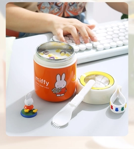 Detail of Miffy orange insulated soup mug with stainless steel liner and folding spoon