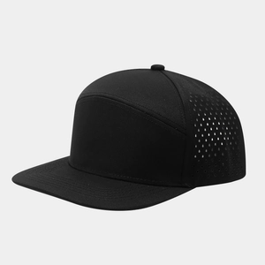 Close-up of laser-cut ventilation holes on a black flat brim performance baseball cap