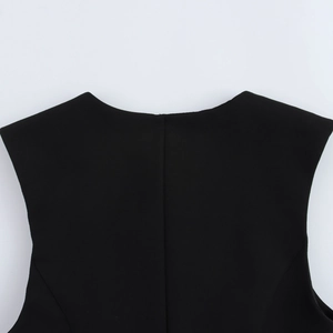 Close-up detail of the crew neckline and premium fabric texture on the black sleeveless top