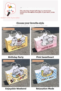 Detail of cartoon puppy gift bags with dimensions 32x16x11cm and white handles