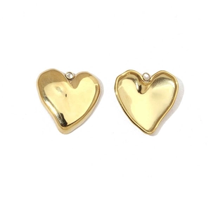 Polished heart-shaped pendant charms in golden finish on a clean white background