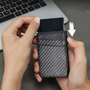 Men's carbon fiber wallet with automatic pop-up card mechanism and leather aluminum finish