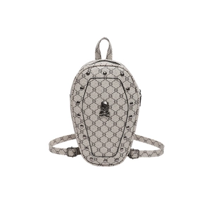 Gothic coffin-shaped backpack with skull studs and monogram print on grey faux leather
