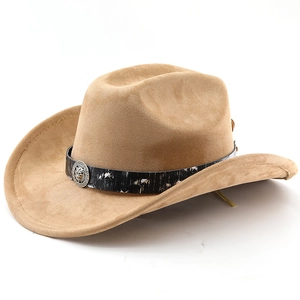 Detail of faux suede western cowboy hat featuring a metal lion head badge on a black band