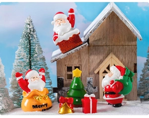Miniature resin Santa Claus and Christmas tree set for festive tabletop decoration