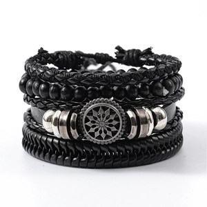Detail view of multi-layer black leather bracelet set with wooden beads and gear charm