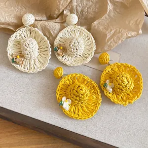 Handmade raffia straw hat drop earrings in cream and yellow with flower details