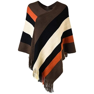 Detail of diagonal stripes and fringe trim on the colorful knitted poncho wrap
