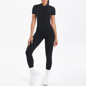 Detailed front view of black short sleeve compression jumpsuit with half-zipper neckline
