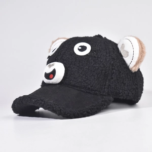 Detail view of black sherpa baseball cap featuring cute cartoon bear face and plush ears