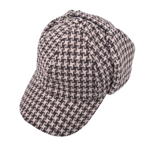 Classic houndstooth deerstalker hat with ear flaps in brown and beige fabric