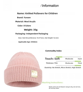 Detailed view of kids pink knit beanie featuring happy face leather patch and ribbed cuff