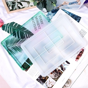 Translucent rectangular silicone mold with geometric compartments for DIY resin jewelry art