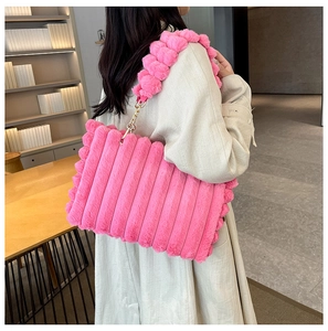 Detail of pink faux fur tote bag with striped texture and bubble design shoulder strap