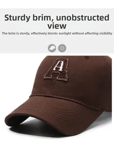Detail of high-quality 3D embroidered letter A on a dark brown cotton baseball cap