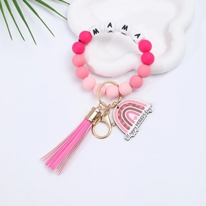 Detail of pink silicone Mother's Day keychain bracelet with MAMA beads and colorful tassel