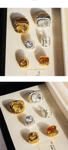 Macro detail of gold and silver rings with unique brushed firework metal texture