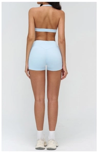 Back view of light blue yoga set with halter bra and high-waist shorts for fitness