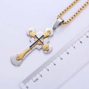 Detailed size measurement of a two-tone gold and silver cross pendant with crystals