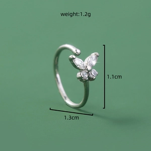 Detail shot of silver butterfly faux nose ring with clear gems and size specifications