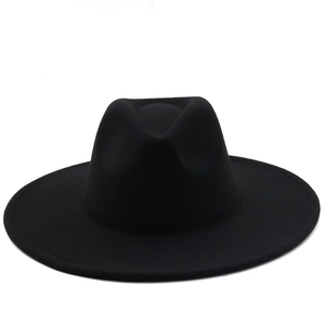 Detailed view of the flat wide brim and structured crown of the black wool fedora hat